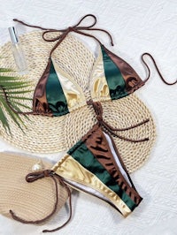 a gold and brown bikini set on a beach