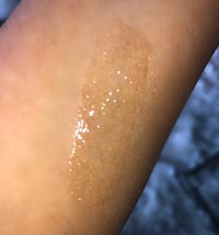 a person's arm with a lot of glitter on it