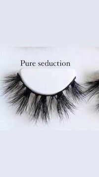 two pairs of false eyelashes with the words pure seduction